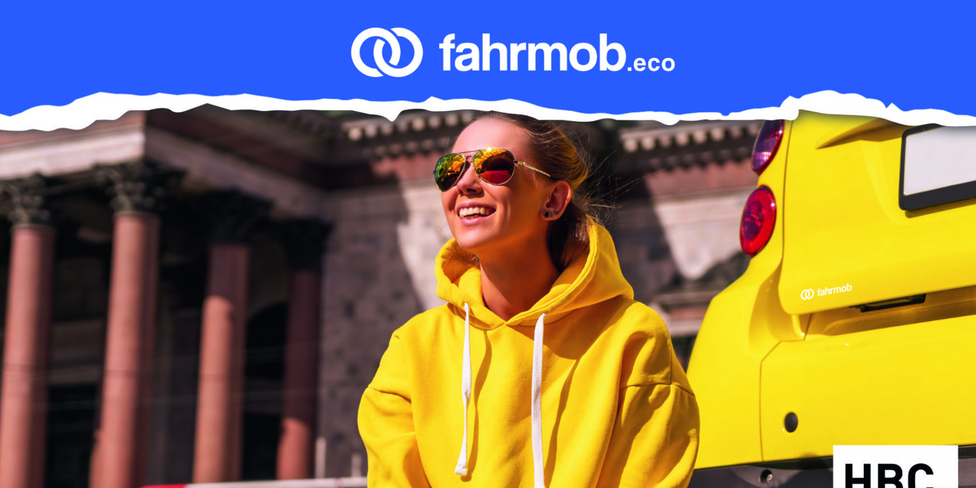 Werbung für Fahrmob: Frau in gelbem Pulli vor gelbem Auto